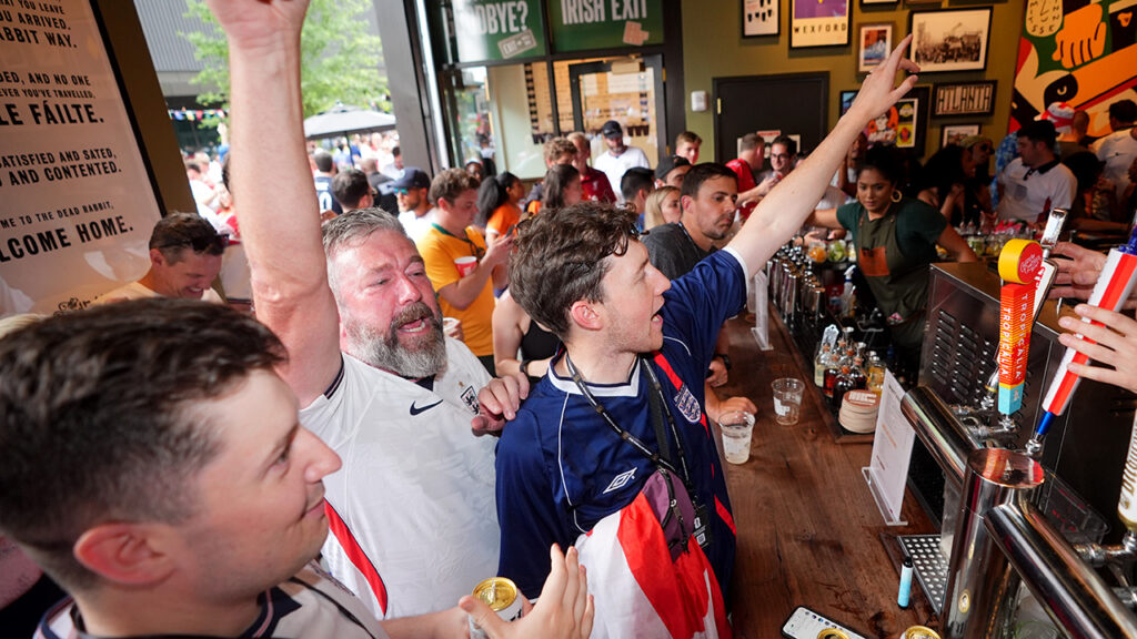 Jubilant England fans celebrating in a bar near the Atlanta Stadium in downtown Atlanta, Georgia, following England’s victory against DR Congo at the 2026